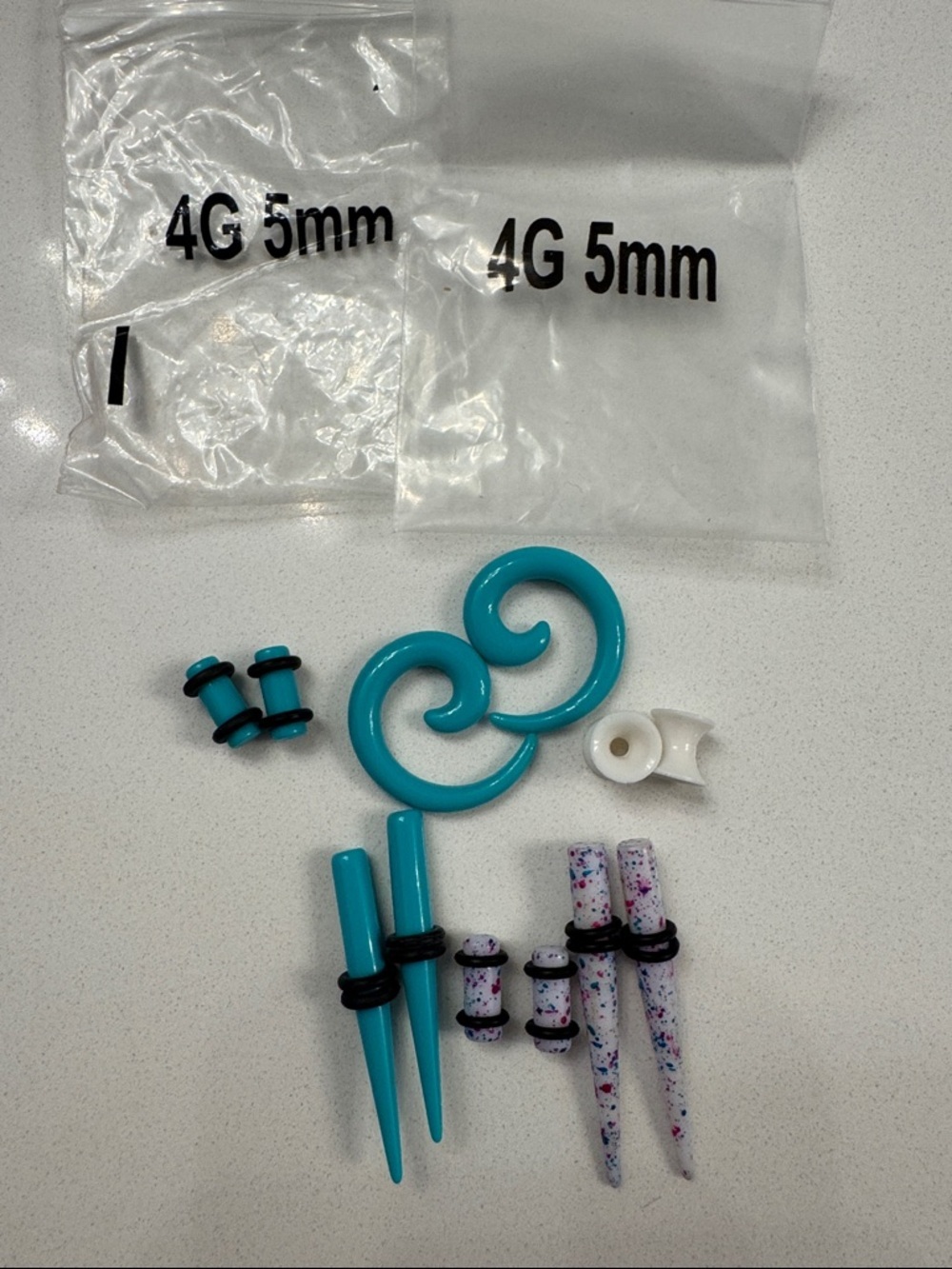 Turquoise Spiral Ear Stretching Kit with Speckled Tapers